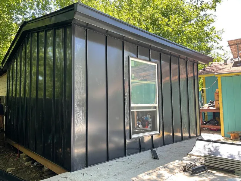 Black standing seam metal wall panels for Roof Inspection in Round Rock