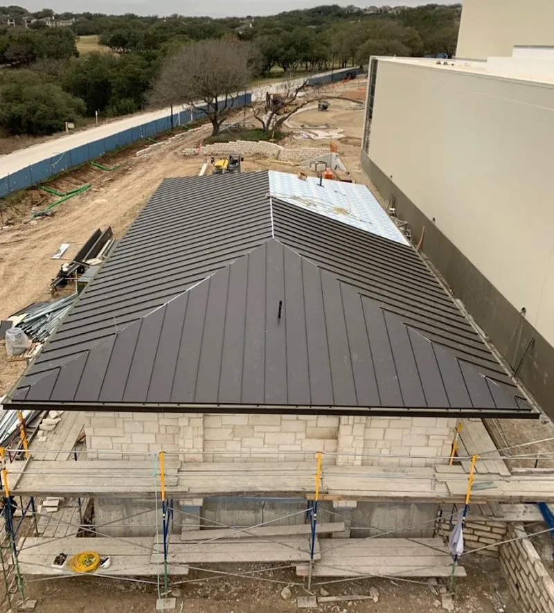 Metal roof new construction with scaffolding in Round Rock